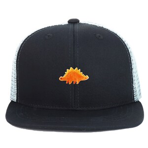 May include: Black trucker hat with a white mesh back and a flat brim. The front panel features an embroidered orange dinosaur design. The hat has a snapback closure for an adjustable fit. A stylish accessory for casual wear.