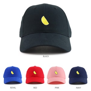 May include: Five baseball caps with a yellow lemon slice embroidered on the front. The caps are available in black, royal blue, red, pink, and navy blue.