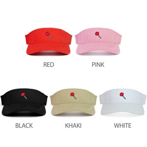 May include: Six different color visors with a red lollipop graphic. The colors are red, pink, black, khaki, and white.