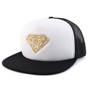 May include: A white and black trucker hat with a gold diamond design embroidered on the front.