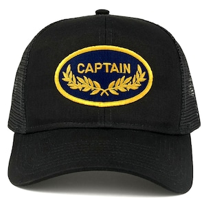 May include: Black trucker hat with a blue oval patch that says "CAPTAIN" in gold lettering with gold laurel wreaths around the oval.