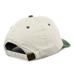 May include: A light beige baseball cap with a dark green underside. The cap has a metal buckle closure.