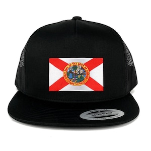 May include: Black trucker hat with a white and red Florida state flag patch featuring the state seal. The seal has the words "Great Seal of the State of Florida" and "In God We Trust".