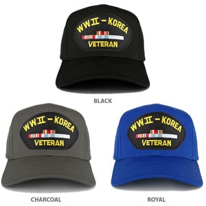 May include: Three baseball caps with a patch that says "WWII - KOREA VETERAN" in yellow letters on a black background. The caps are black, charcoal gray, and royal blue.