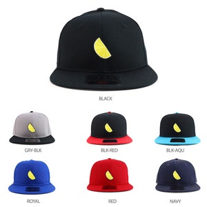 May include: A set of nine baseball caps with a yellow lemon slice embroidered on the front. The caps are available in black, gray, red, blue, and navy.