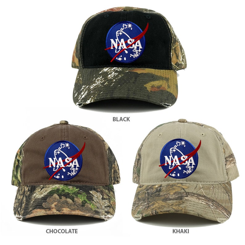 May include: Three camouflage baseball caps with a NASA logo embroidered on the front. The caps are available in black, chocolate brown, and khaki.