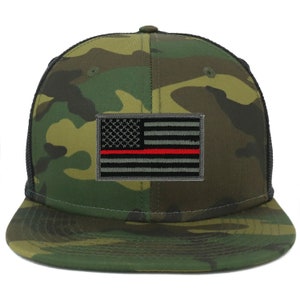 May include: A camouflage trucker hat with a black mesh back and a gray and red American flag patch with a thin red stripe.