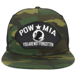 May include: A black and green camouflage trucker hat with a black patch that says "POW MIA You Are Not Forgotten".
