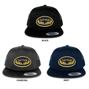 May include: Three trucker hats in black, charcoal, and navy blue with a navy blue oval patch that says "CAPTAIN" in gold lettering with gold laurel wreaths on either side.