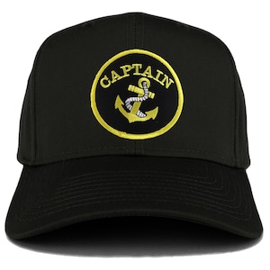 Puede incluir: Gorra de béisbol negra con un ancla bordada en amarillo y la palabra "CAPTAIN" alrededor.