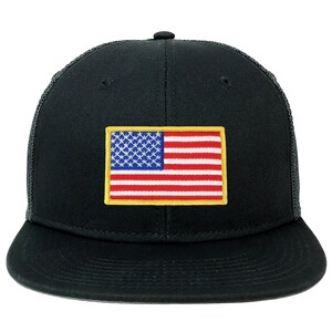 May include: A black trucker hat with a mesh back and a red, white, and blue American flag patch on the front. The flag patch has a yellow border.