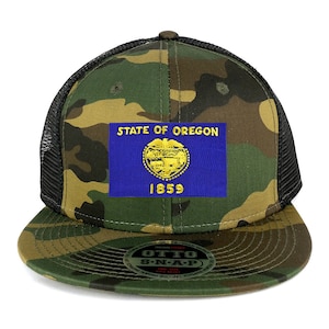 May include: A camouflage trucker hat with a black mesh back. The front of the hat features a blue and gold embroidered patch with the words "State of Oregon" and the year "1859".