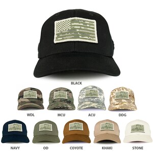 May include: A collection of baseball caps in various camouflage patterns and solid colors, each featuring a patch of a green, white, and brown American flag. The caps are arranged in two rows, with the top row showing the camouflage patterns and the bottom row showing the solid colors. The colors include black, woodland digital, multicam, desert digital, navy blue, olive drab, coyote brown, khaki, and stone.