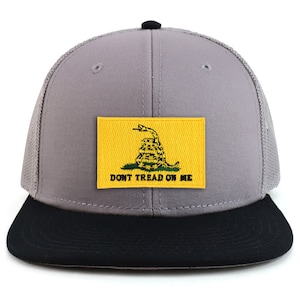 May include: A grey and black trucker hat with a yellow patch featuring a coiled snake and the text "Don't Tread On Me".