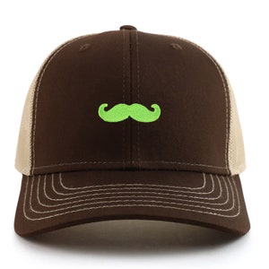 May include: A brown and tan baseball cap with a green embroidered moustache on the front.