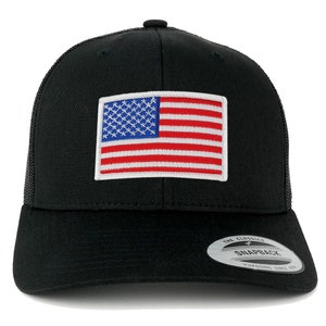 May include: Black baseball cap with a mesh back and a flat brim. The front features a rectangular patch with an embroidered American flag. The cap has a snapback closure and a curved brim. The brand name "Snapback" is visible on the tag.