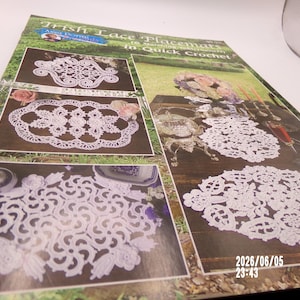 May include: A craft pattern booklet titled Irish Lace Placemats in Quick Crochet featuring white crocheted lace designs on a dark background. The cover displays multiple oval and circular lace patterns with floral motifs and a date stamp 2026/06/05.