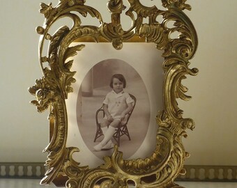 Bronze photo frame. Antique photo frame with a rocaille decor. Louis XV style.