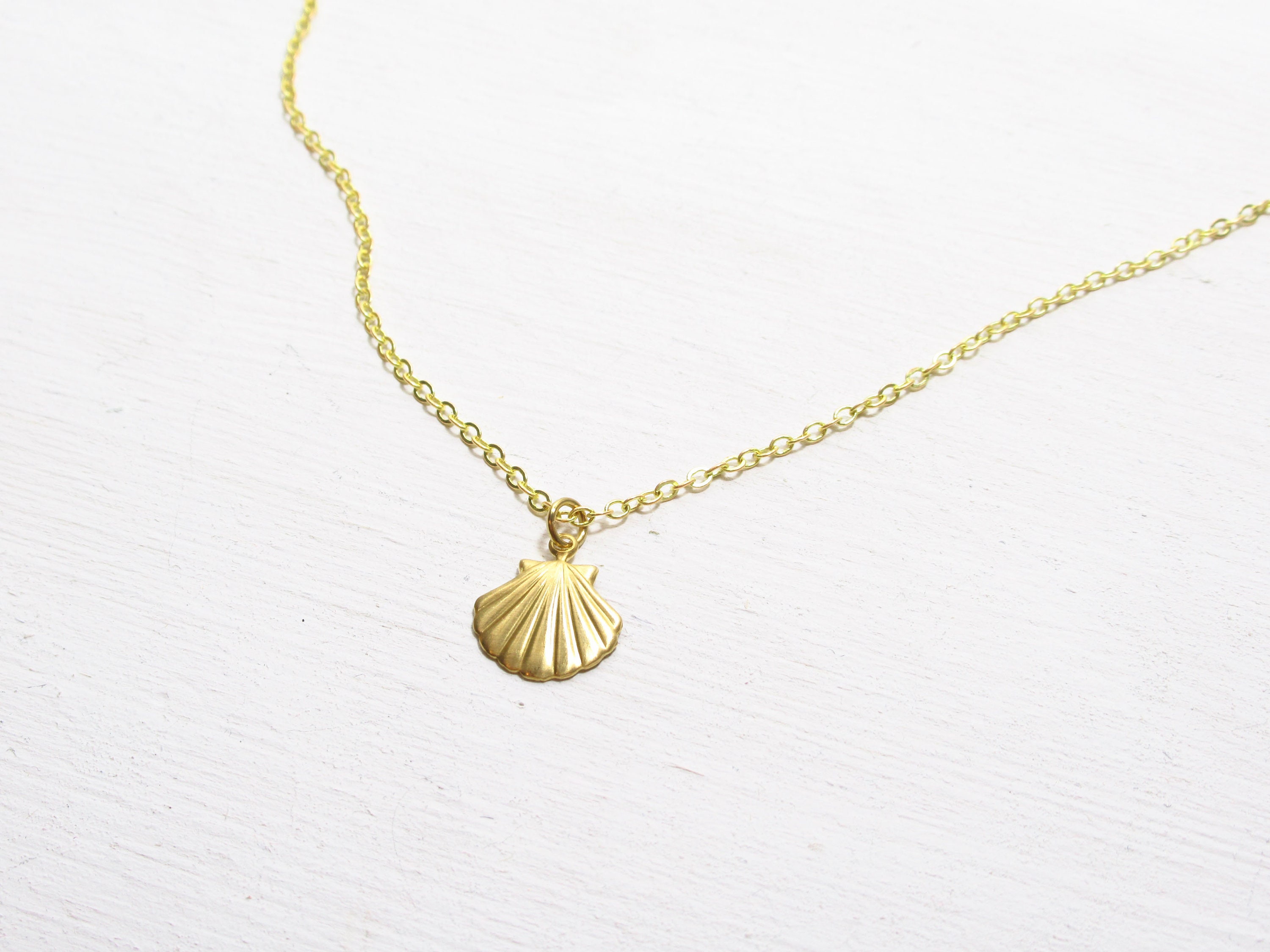 Gold shop shell pendant