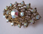 Vintage art deco style carnival glass brooch in gold setting from 1970s 1980s