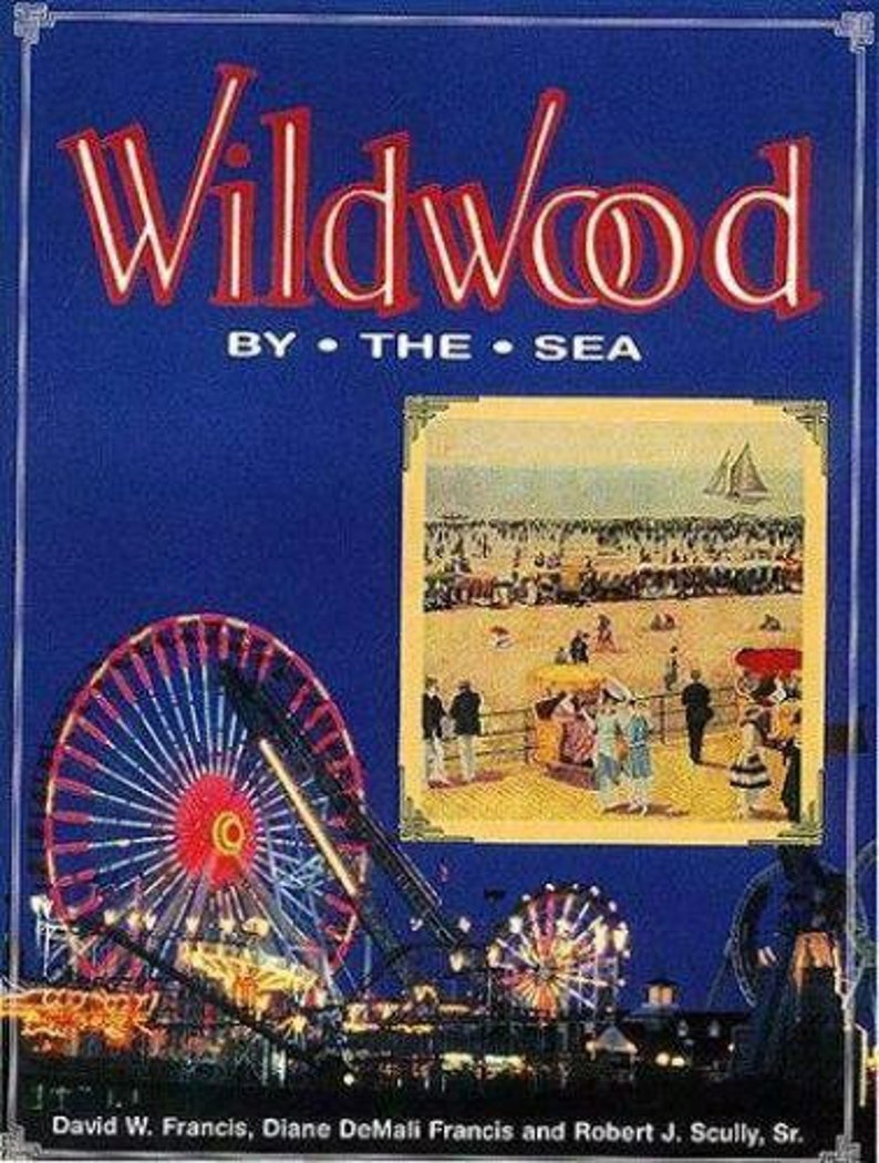 May include: A vintage postcard depicting a nighttime view of the Wildwood boardwalk with a Ferris wheel and other amusement park rides. The text on the postcard reads "Wildwood by the Sea".