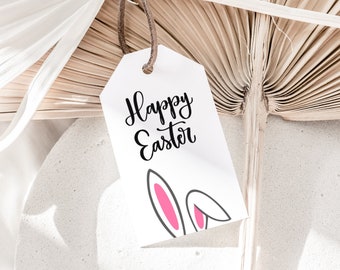 May include: A white gift tag with black script that says "Happy Easter" and pink bunny ears on the bottom.