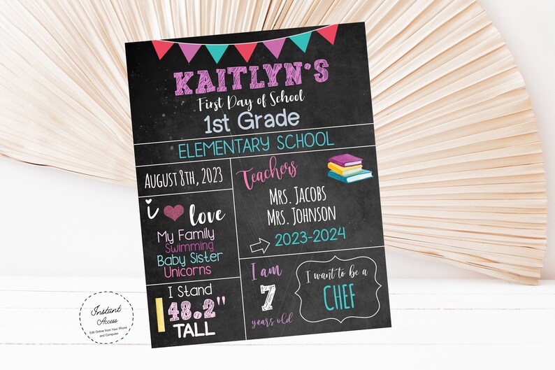 May include: A chalkboard sign with a pink, teal, and red banner at the top. The sign says "Kaitlyn's First Day of School 1st Grade Elementary School August 8th, 2023 Teachers Mrs. Jacobs Mrs. Johnson 2023-2024 I love My Family Swimming Baby Sister Unicorns I Stand 48.2" tall I am 7 years old I want to be a CHEF".