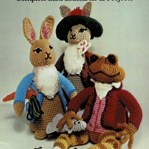 May include: A book cover featuring crocheted dolls of Peter Rabbit and his friends. The book title is "Peter Rabbit and His Friends Dolls to Crochet" and the subtitle is "Complete Instructions for 11 Projects".