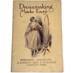 May include: Vintage book cover titled "Dressmaking Made Easy." The cover features an illustration of a woman in a dress, standing near a mirror. The text "WOMAN'S INSTITUTE of DOMESTIC ARTS & SCIENCES SCRANTON, PENNA." is also visible.