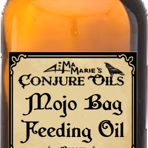 May include: A 1 ounce bottle of Mojo Bag Feeding Oil, a conjure oil from 4:11 Marie's Deep Down South Louisiana. The bottle is amber glass with a black cap and a black and white label with a crow illustration.