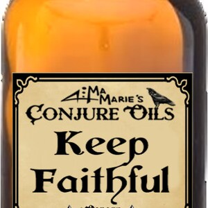 May include: A brown glass bottle with a black cap and a label that reads "4:11 Ma Marie's Conjure Oils Keep Faithful 1 ounce Deep Down South Louisiana".