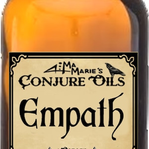 May include: A brown glass bottle with a black cap and a label that reads "Aunt Marie's Conjure Oils Empath 1 ounce Deep Down South Louisiana".