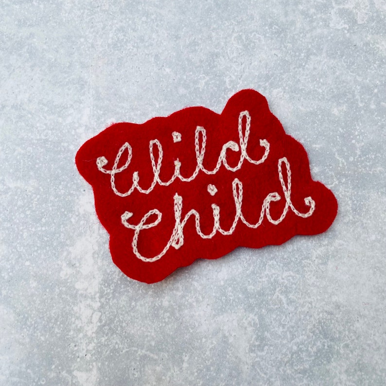 Custom vintage chain stitch name patch in red and white.
