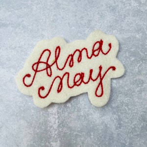 Custom vintage chain stitch name patch in white and red.