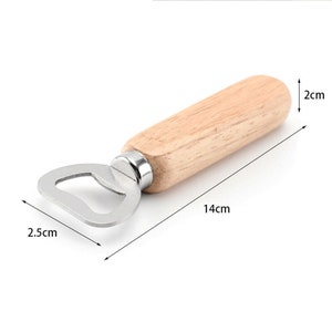 May include: A wooden and stainless steel bottle opener with a 2 inch wide handle and a 14 inch long body. The opener is 2.5 cm wide.