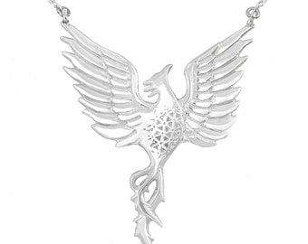 May include: A silver necklace with a detailed phoenix pendant. The phoenix is depicted with its wings spread and its tail feathers flowing.
