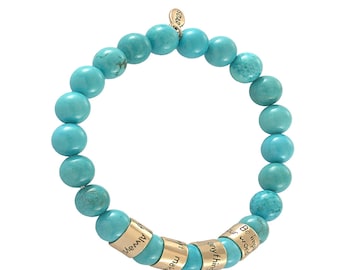 May include: Turquoise beaded bracelet with gold charm beads. The charm beads have the words "Be the impact", "Your world", "Anything", "Make it", "Always" engraved on them.