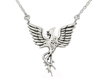 May include: A silver necklace with a phoenix pendant. The phoenix is depicted with its wings spread and its tail feathers flowing.
