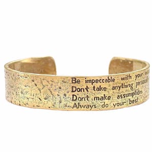 The Four Agreements Matte Textured Reminder Cuff (brass)