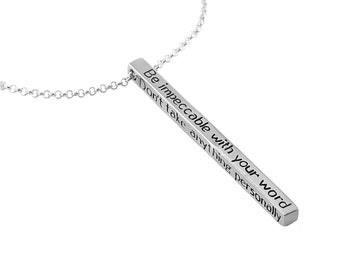 May include: Silver necklace with a bar pendant that reads "Be impeccable with your word. Don't take anything personally."
