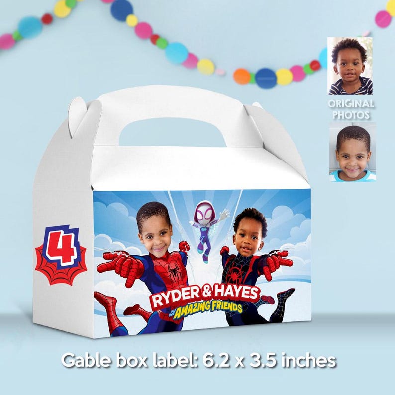 May include: White gable box with a handle, featuring a superhero theme. The box has a blue sky background with two children dressed as superheroes. Text on the box reads "RYDER & HAYES AMAZING FRIENDS". The box label measures 6.2 x 3.5 inches.