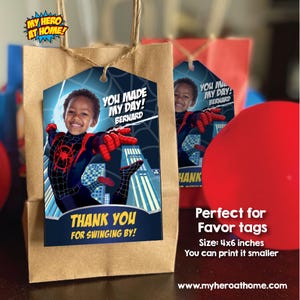 May include: A favor tag with a cartoon image of a child dressed as Spider-Man. The tag has the text "You made my day! Bernard" and "Thank you for swinging by!" printed on it. The tag is 4x6 inches.