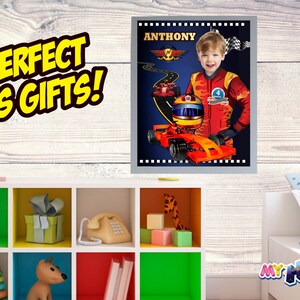 May include: Personalized racing poster featuring a child in a red racing suit, holding a helmet, with a red race car and a blue background. The poster has the name "ANTHONY" at the top and the text "My Hero at Home" at the bottom.