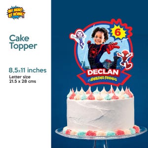 May include: A white cake with colorful frosting, topped with a Spider-Man themed cake topper. The topper features a photo of a child, the number 6, and the text "DECLAN AMAZING FRIENDS". The cake topper is 8.5 x 11 inches.