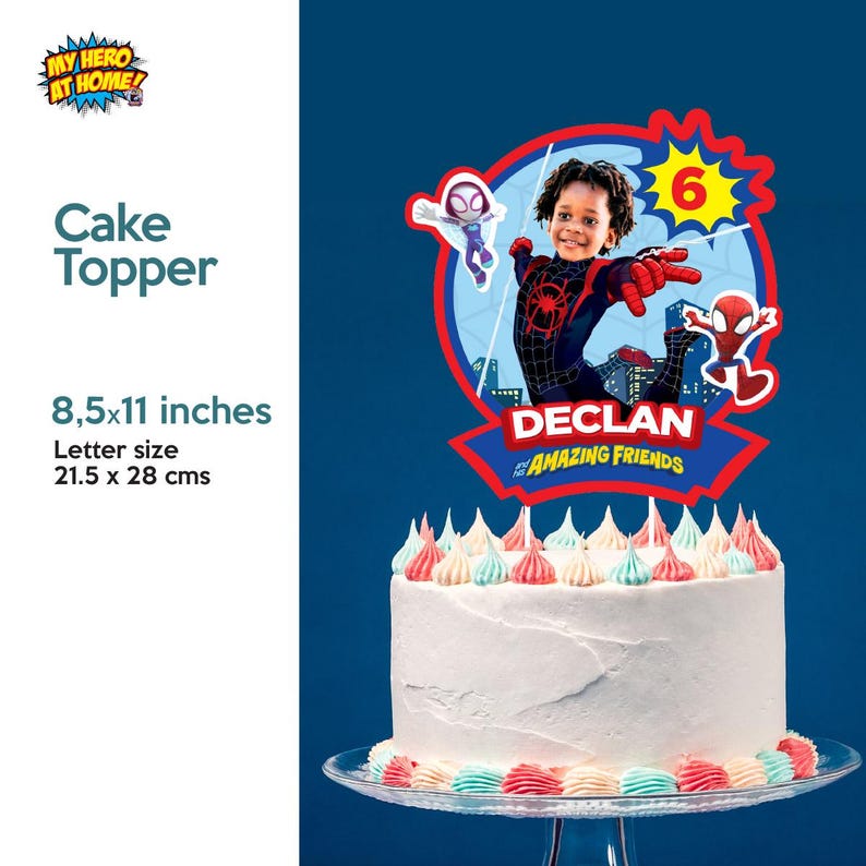 May include: A white cake with colorful frosting, topped with a Spider-Man themed cake topper. The topper features a photo of a child, the number 6, and the text "DECLAN AMAZING FRIENDS". The cake topper is 8.5 x 11 inches.