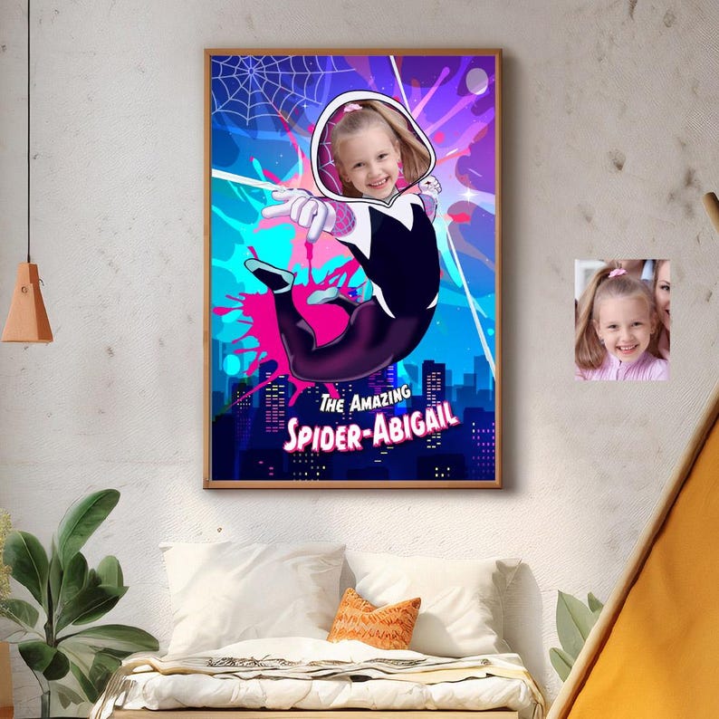 May include: A framed artwork featuring a young girl in a Spider-Gwen costume, leaping against a cityscape backdrop. The artwork includes the text "THE AMAZING SPIDER-ABIGAIL" and a smaller photo of the girl.