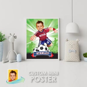 May include: A custom mini poster featuring a cartoon illustration of a boy playing soccer. The boy is wearing a red and blue jersey with the word "Stanley" on it. The poster has a green background with a soccer field and a soccer ball.