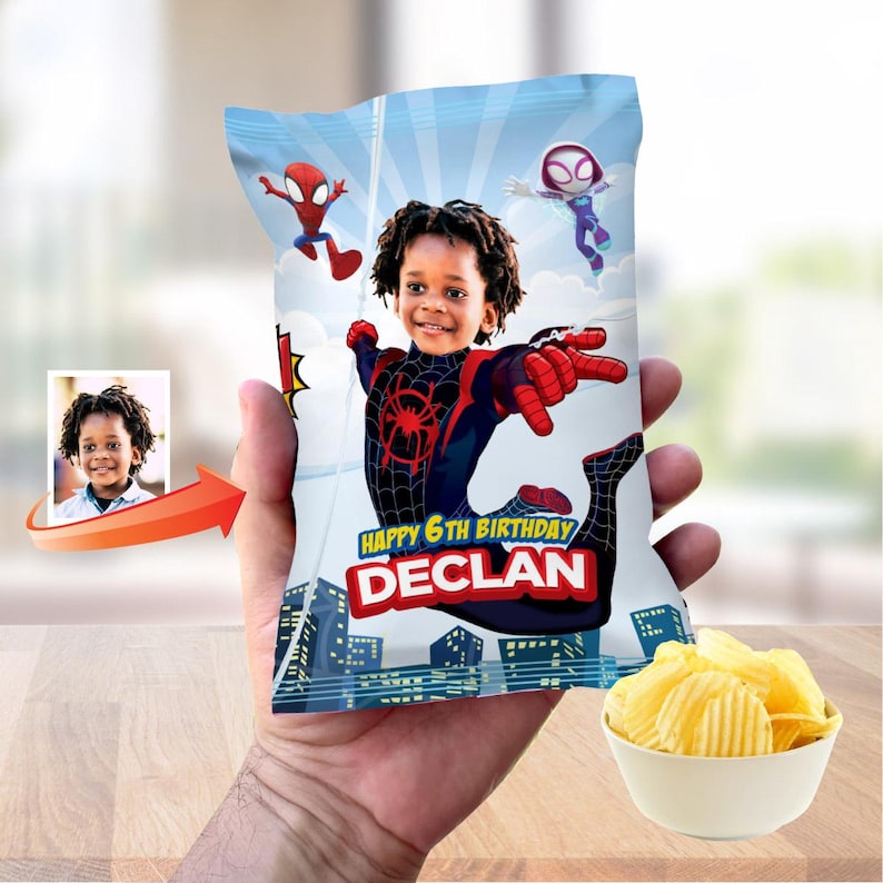 May include: A custom snack bag featuring a graphic of a child dressed as a superhero with a spider emblem on the chest. The bag includes the text Happy 6th Birthday and the name Declan, set against a blue sky and city skyline background.