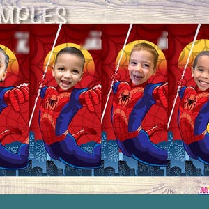 May include: Four children's faces are superimposed on a red and blue Spider-Man costume design. The background features a cityscape silhouette, a yellow sun, and the words "SAMPLES" and "MY HERO at Home".