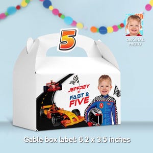 May include: White gable box with a handle, featuring a race car theme. The box has a large number 5 on top and a graphic of a race car and the text "JEFFREY IS FAST & FIVE". The box measures 6.2 x 3.5 inches.